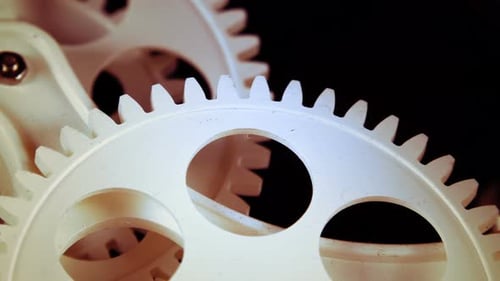 White Plastic Gears Rotating Close Up
