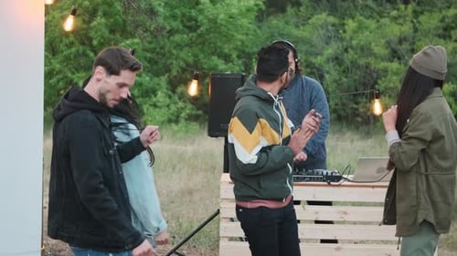 Young Adults Dancing at Outdoor Party