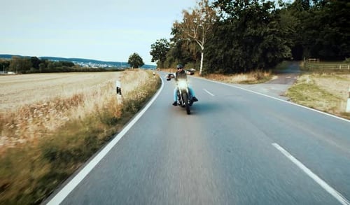Motorcyclist Drives Down Rural Road