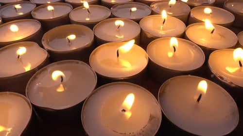 Glowing Candles in Warm Light