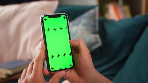 Closeup of Smartphone with Green Screen Young Man Hands Holding Mobile Phone Zoom in Isolate Display