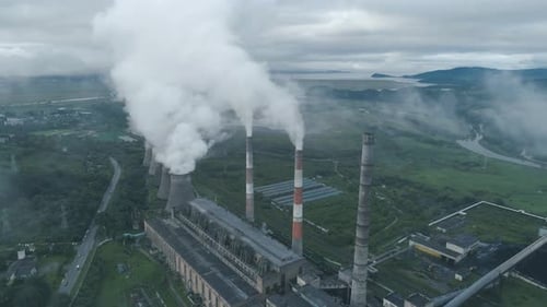 Aerial Drone View of Smoking Pipes and Cooling Towers of Coal Thermal Power Plant