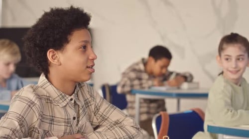 Child Attends School Class and Writes