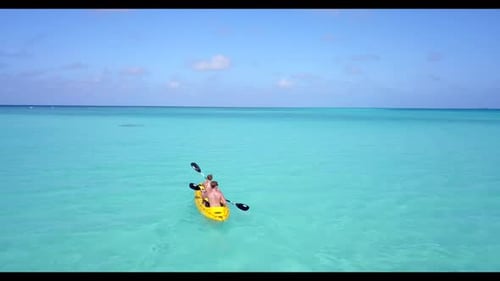 Two people suntan on exotic sea view beach break by blue green lagoon and white sandy background of