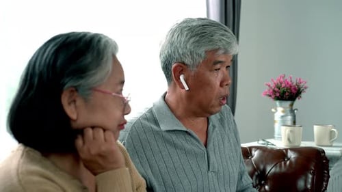 Elderly Asian Using Modern Gadgets