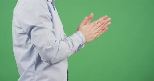 Side view of a man rubbing his hands