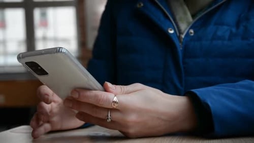 Woman Using a Smartphone Indoors