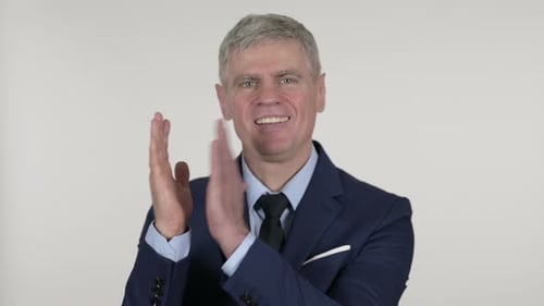Gray-Haired Man in Suit Clapping
