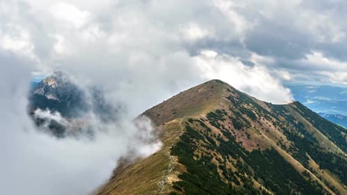 Clouds Moving Fast in Mountains in Alps Landscape