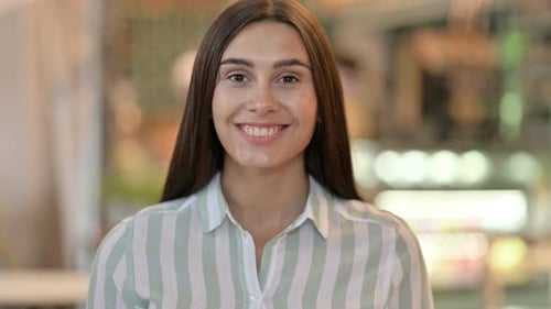 Smiling Woman Looking at Camera in Close Up
