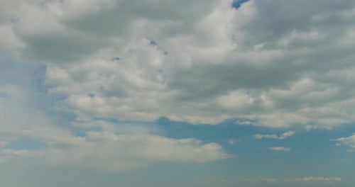 Clouds Moving in a Blue Sky on Bright Day