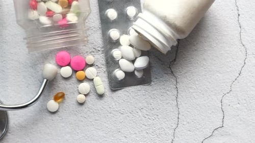 Variety of Pills and Medical Supplies Top-Down