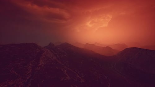 Dramatic Sky Over Rocky Mountains at Sunset