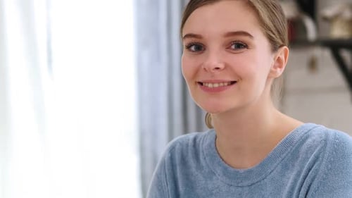 Close Up of Smiling Positive Beautiful Young Woman Model at Home