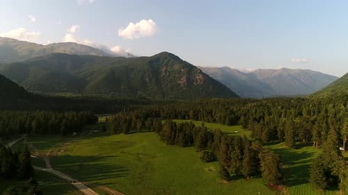 Aerial View Green Valley with Mountains in the Background