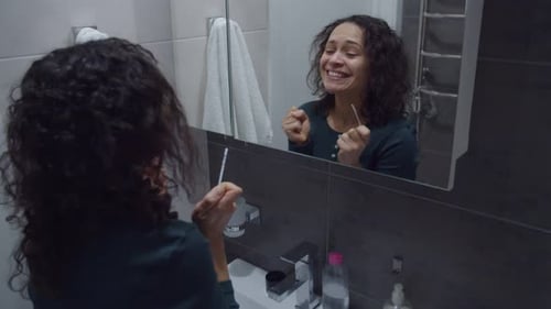 Woman Reacts Joyfully to Pregnancy Test in Bathroom