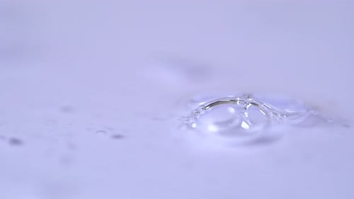 Clear Soap Bubbles on Purple Wet Surface
