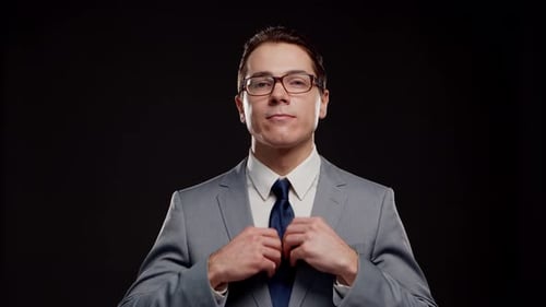 Studio portrait of successful and smart businessman in suit and tie.