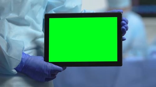 Hospital Worker Holding Green Screen Tablet, Health Insurance App, Clinic Site