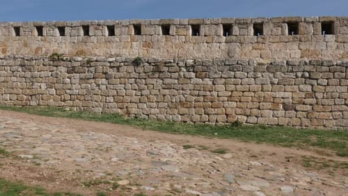 Old castle rampart against blue sky 3840X2160 UHD tilting footage - Protecting stone wall slow til