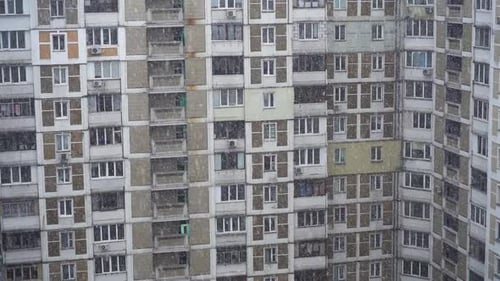 Windows of Residential Houses Close-up in Snowy Time