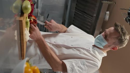 Chef Prepares Vegetables in Commercial Kitchen