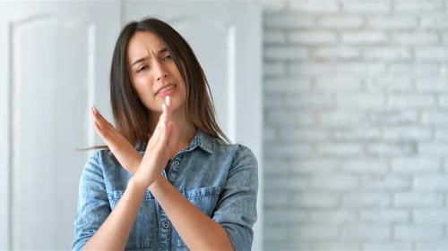 Woman Expressing Disagreement with Hand Gestures