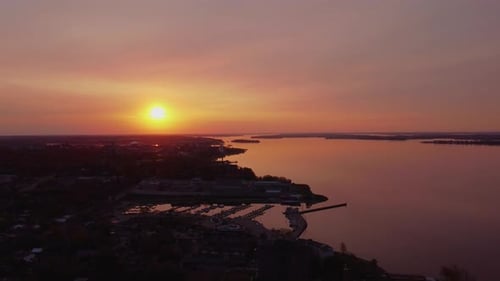 Aerial red sky sunset near city waterfront view