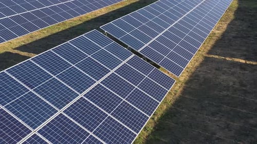 Aerial View of Solar Panels in Rural Field