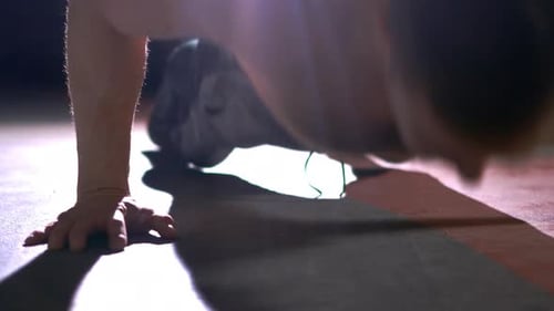 Man Doing Pushups on Floor