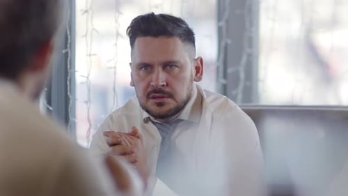 Man Attends Intense Corporate Meeting