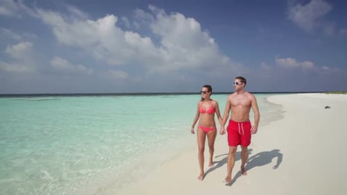 Couple Walking on Beach
