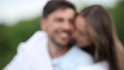 Joyful Couple Laughing in a Loving Embrace