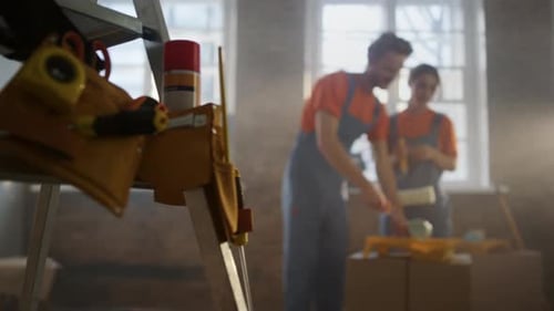 Young Family Doing Home Repair in New House