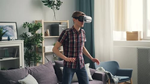 Man Experiencing Virtual Reality Headset in Living Room