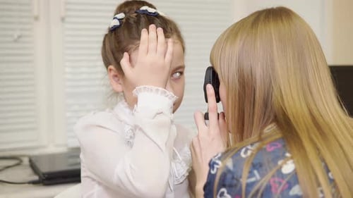 Child Having Eye Exam in Clinic Setting