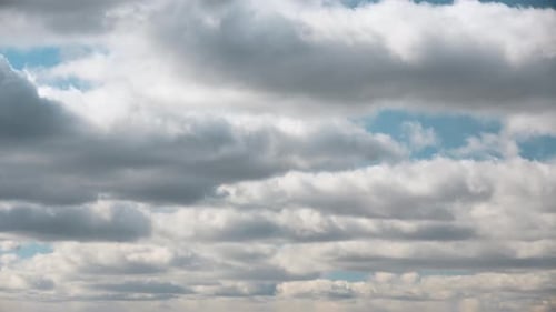 Cloudy Sky With Fluffy Clouds