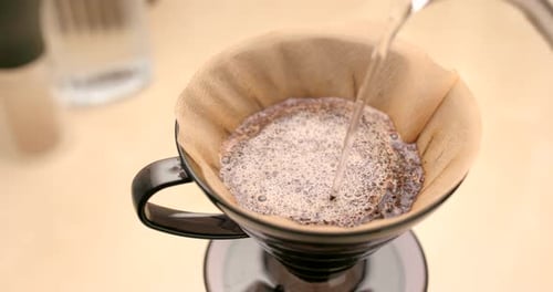 Hot Water Brewing Coffee with Paper Filter Close Up