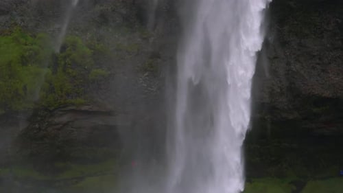 Water Flows Down a Powerful Stream at a Waterfall