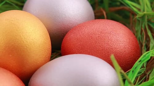 Colorful Easter Eggs in Artificial Green Grass
