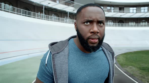 Angry Runner Starting To Run on track.African American Man Training on ...