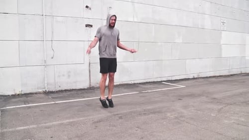 Man Jumping Rope in Urban Environment