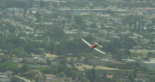 Streams of sunlight pouring through overcast, cloudy sky onto green mountains, helicopter aerial, da