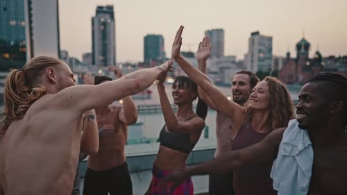 Happy Athletic Group Giving Each Other High Fives