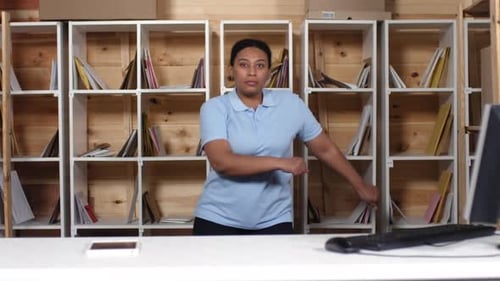Black Female Clerk Doing Floss Dance in Post Office