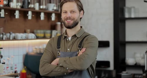 Smiling Barista Portrait in Coffee Shop Setting