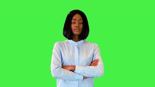 Young Adult Posing in Front of Green Screen