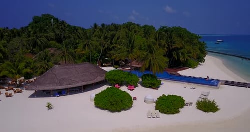 Natural aerial travel shot of a sunshine white sandy paradise beach and aqua blue ocean background i