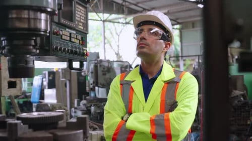 Smart Factory Worker Using Machine in Factory Workshop