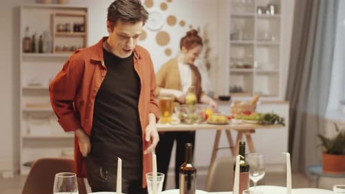 Couple Preparing Dinner at Home, Lighting Candles